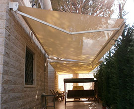 Folding arm awnings